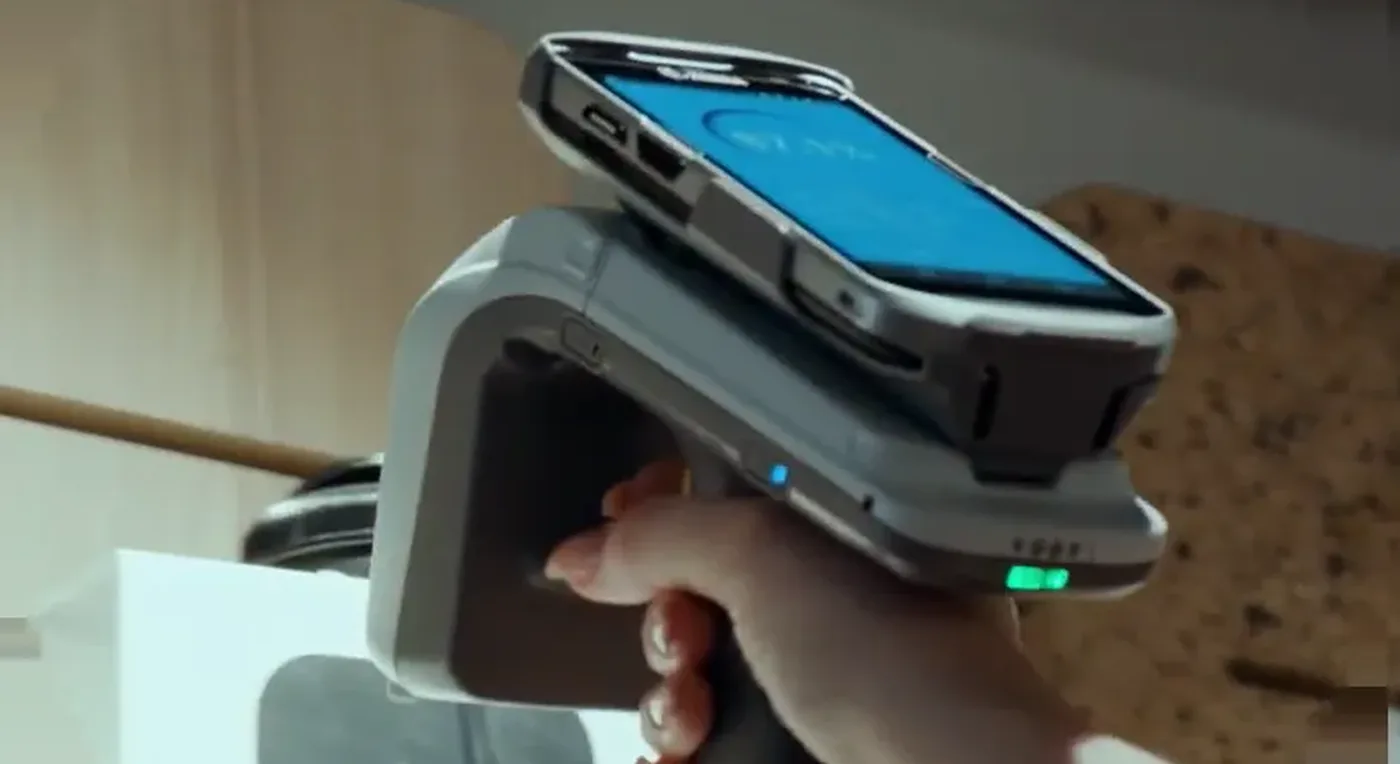 Handheld scanner reading a barcode