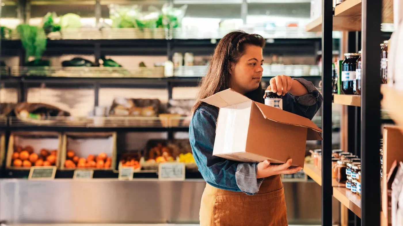 Retail store employee using a handheld app on the shop floor