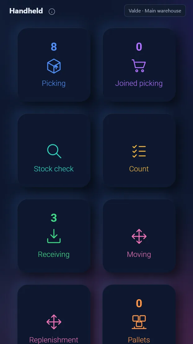 Handheld scanner showing a warehouse purchase order receiving screen